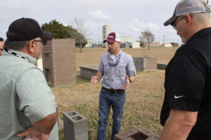 Robert Puckett teaching at RELLIS campus with pest control professionals in the foreground